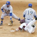 University of Arkansas base runner Collin Kuhn beats the throw to second base as South Dakota State ...