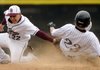 Bentonville’s Chris Scroggins, right, beats the tag by Siloam Springs’ R.J. Castillo on a steal at second base during the Tigers’ game Wednesday against the Panthers in the Best Sports Classic at the Tiger Athletic Complex in Bentonville.