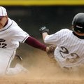 Bentonville’s Chris Scroggins, right, beats the tag by Siloam Springs’ R.J. Castillo on a steal at s...