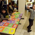 Luz Martinez, 10, tries to lure buyers to her Fast Frames table Wednesday in the student union at No...