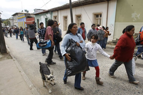 people-walk-up-a-hill-following-a-72-magnitude-aftershock-in-constitucion-chile-thursday