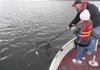 Jason Piper and his daughter, Katelyn, catch crappie at Beaver Lake last October.
