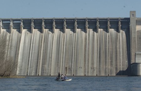 
                               
                                  Photo by Flip Putthoff&mdash;
                               
                           
                           Anglers fish for trout in front of Bull Shoals Dam.