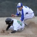 Rogers High’s Alex Flowers tries to tag out Van Buren’s Alex Dumas during a game Wednesday at Vetera...