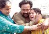 Pakistani family members mourn a death in a suicide bombing in Lahore, Pakistan on Friday.