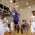  Fayetteville’s Colton Primm, center, lays the ball up for two points over Bentonville’s Tyler Hagga...