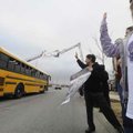 STAFF PHOTO J.T. WAMPLER 


 Fayetteville High School students, parents and faculty give the boys...