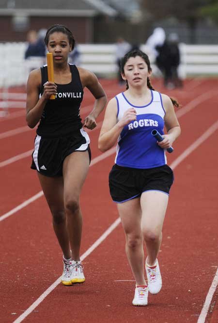 Bentonville’s Asia Patterson, left, stays ...
