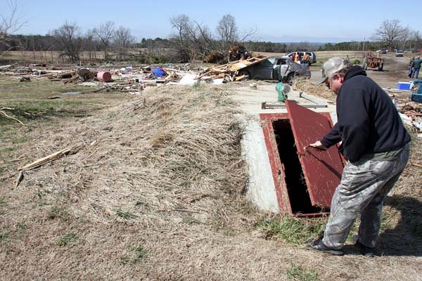 danny-west-of-clinton-checks-the-door-of-a-storm-shelter-outside-the-destroyed-home-of-ward-and-iva-jean-baldridge-in-pearson-thursday-after-a-tornado-hit-the-home-wednesday-night-killing-ward-and-injuring-iva-jean-and-their-grandson-blake-west-is-a-relative-they-were-on-their-way-to-the-shelter-when-it-hit-razing-the-house-and-leaving-them-out-in-a-field