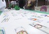 Kylee Aaron, 10, prepares for the arrival of the Fundred Sous Terre armored truck Friday that will take Fayetteville Fundred Dollar Bills — original, hand-drawn interpretations of $100 bills — from Leverett Elementary School to Washington D.C.