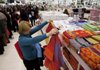 A shopper checks out the beach towels earlier this month at a Century 21 department store in New York.