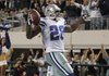 Dallas Cowboys running back Felix Jones celebrates as he runs in to the end zone for a touchdown in the second half of an NFL football game.