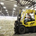 AERT ADVANCES - Marcus Kirk moves barrels of plastic to be recycled Thursday at the new AERT recycli...