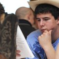 YOUTH LEADERSHIP - James Harter, 15, of Fayetteville, reads over material Saturday during the 2010 A...