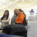 Tham Vo, left, with the U.S. Census Bureau, takes a picture of Juan Carlos Ocamas and Celia Ocamas d...