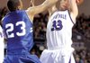 Fayetteville senior Adam Nobel, right, has the ball knocked from his hands by Conway senior Preston Purifoy during the second half of the Class 7A State Championship on Friday in Summit Arena in Hot Springs. Conway defeated Fayetteville 66-56.