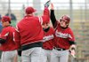 MCDONALD’S INVITATIONAL - Springdale High’s Evan McCarville, right, is congratulated by teammates and coaches after scoring a run against Shiloh Christian on Saturday at Tyson Sports Complex in Springdale.