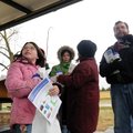 Heather Edmonson, 9, clutches a Red Bud sapling that she hopes to plant Saturday at Murphy Park afte...