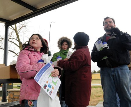 Heather Edmonson, 9, clutches a ...