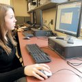 Bentonville High School senior Ashlynn Newberry works with an industrial grade engineering program c...