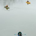 Scott Sanders of Fayetteville, foreground, fishes for walleye and white bass in the White River on S...
