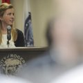 Caroline Kelley with the Rogers High School Business Academy speaks Friday at City Hall to area offi...