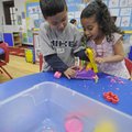Eric Sifuentes, left, and Emely Martinez enjoy some free time Thursday at the Early Childhood Center...
