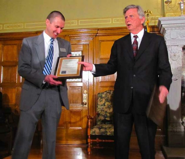 gov-mike-beebe-presents-a-plaque-to-a-representative-from-conway-high-school-one-of-eight-schools-selected-to-take-part-in-the-arkansas-advanced-initiative-for-math-and-sciences-program