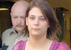 Sheriff’s Deputy Jeremy Kissire escorts Amber Turley from the Conway County Courthouse in Morrilton after she pleaded guilty Tuesday to felony child endangerment.
