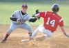 Gentry shortstop Cody Stewart, left, reaches to apply the late tag as Farmington’s Spencer Boudrey steals second base during the fifth inning of Monday’s game in Farmington.