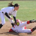 Bentonville second baseman Meg McGuirt, left, applies the late tag as Farmington’s Teighlor Williams...