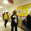 Area educators view a U.S. history timeline on display in the Leverett Elementary School hallways du...