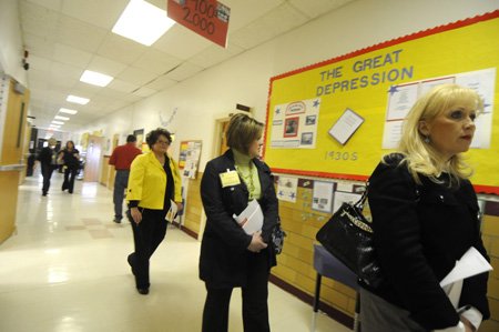 Area educators view a U.S. ...