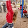 Kelly Fields, a fifth-grader at Grace Hill Elementary School in Rogers, wins a contest Monday by han...