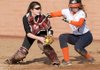 Rogers Heritage’s Lauren Bundy, right, scores before being tagged by Siloam Springs catcher Ashley Lasater during Monday’s game at Veterans Park in Rogers.