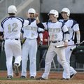 Shiloh Christian’s David Petrino, right, meets Josh Salsbury at home plate after Salsbury scored aga...