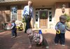 Congressman Vic Snyder, D-Ark., plays with his 15-month old triplets' (left to right) Sullivan, Wyatt and Aubrey, outside their Little Rock home, March 5.