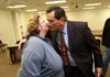 Cindy Wise, wife of slain Salvation Army Major Philip Wise, greets North Little Rock Police Chief Danny Bradley on Tuesday afternoon after Bradley announced an arrest in the case.