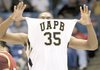  Arkansas-Pine Bluff forward Lebaron Weathers shows off the team's name on his jersey after Pine Bluff defeated Winthrop 61-44 in the NCAA college basketball tournament opening game, Tuesday