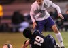 Fayetteville’s Austin Murders looks to gain possession of the ball after colliding with Springdale Har-Ber’s Jorge Gonzalez during 7A-West Conference soccer action Tuesday in Fayetteville.