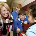 Leverett Elementary School Principal Cheryl Putnam listens to a recording of the Superman radio show...