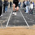 Bentonville’s Tyler Trudo competes in the triple jump during the 2009 Mountie Relays.