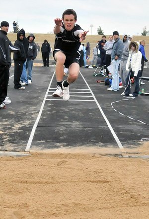 Bentonville’s Tyler Trudo competes in the triple jump during the 2009 Mountie Relays.
