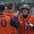 HERITAGE’S HERO - Rogers Heritage’s Reed Brown, right, is congratulated by teammates after hitting a...
