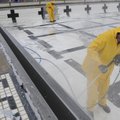 PAINT REMOVAL - Jeff Sullivan, right, and Chris Banja with Blue Water Pools of North Little Rock rem...