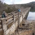 The hand-cut limestone dam at Lake Leatherwood in Eureka Springs was built in the 1940s. Hikers, fro...