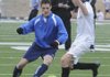 Rogers High’s Spencer Dunlop, left, dribbles around teammate Julian Tietze during practice Wednesday.