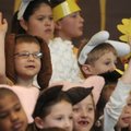 ALL SMILES - Collin Sims, 7, a first-grader at Bellview Elementary School in Rogers, waves to his pa...