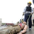 FITNESS TEST - Matt Morrow simulates dragging an injured firefighter Wednesday during the physical f...