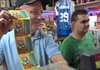 Tony Zimmerman, left, sells scratch-off lottery tickets to a customer at his store Zimmerman's Exxon on S. University Ave.